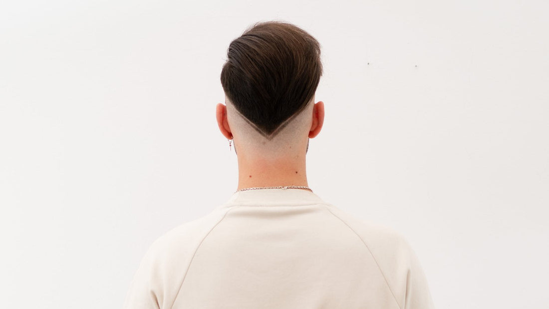 Back of a finished taper fade, showing the gradient across the nape