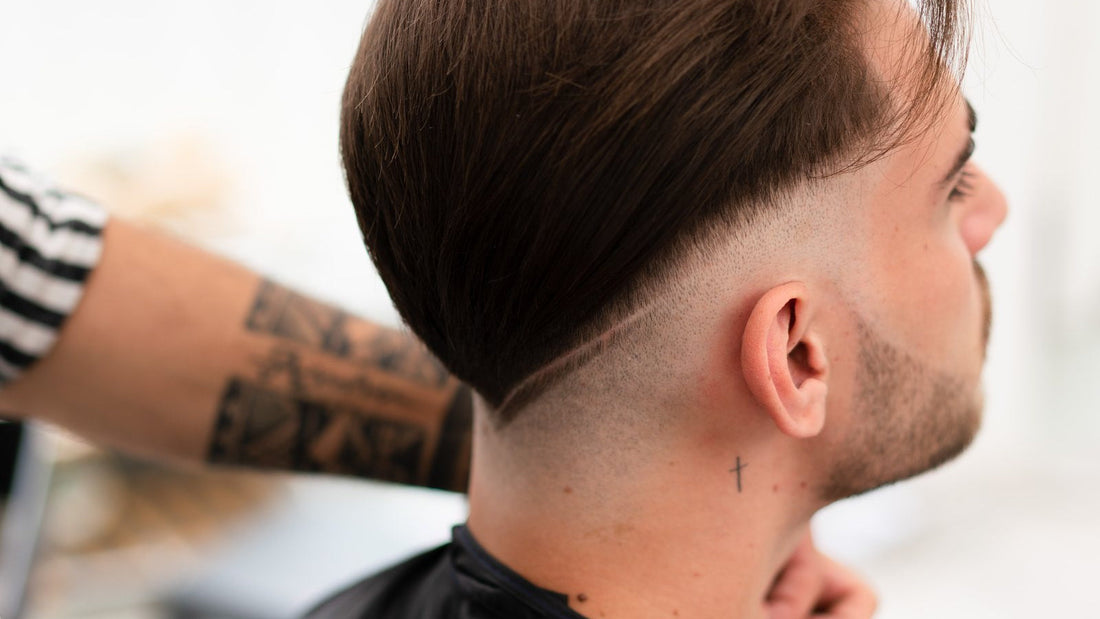 Close side profile of a finished skin fade showing the blend from skin to length