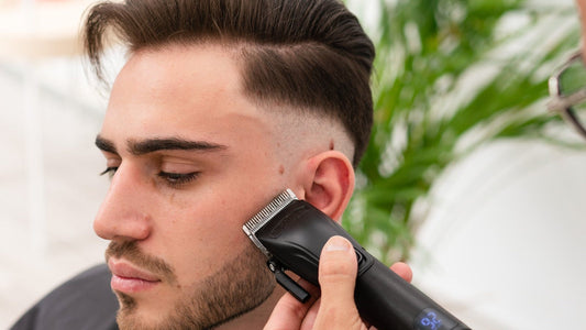 Trimmer tapering the sideburn down into the beard